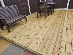 Decking is soft washed with biocide