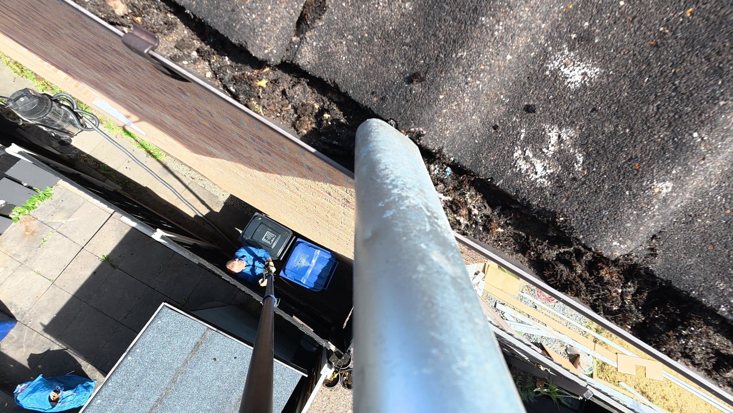 Gutter cleaning with SkyVac vacuum system